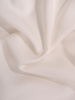 Nowoczesna sukienka z falbaną, biała kreacja wykończona koronką 21474