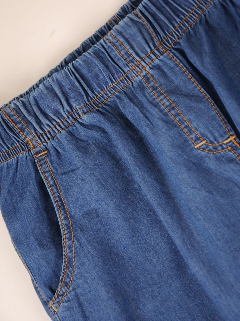 Granatowe klasyczne spodnie wide leg z gumką w pasie – elegancko modelujące sylwetkę na co dzień 38261