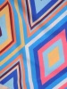 Niebieska bluzka wizytowa w geometryczny wzór – luźny fason z dekoltem w serek 39488